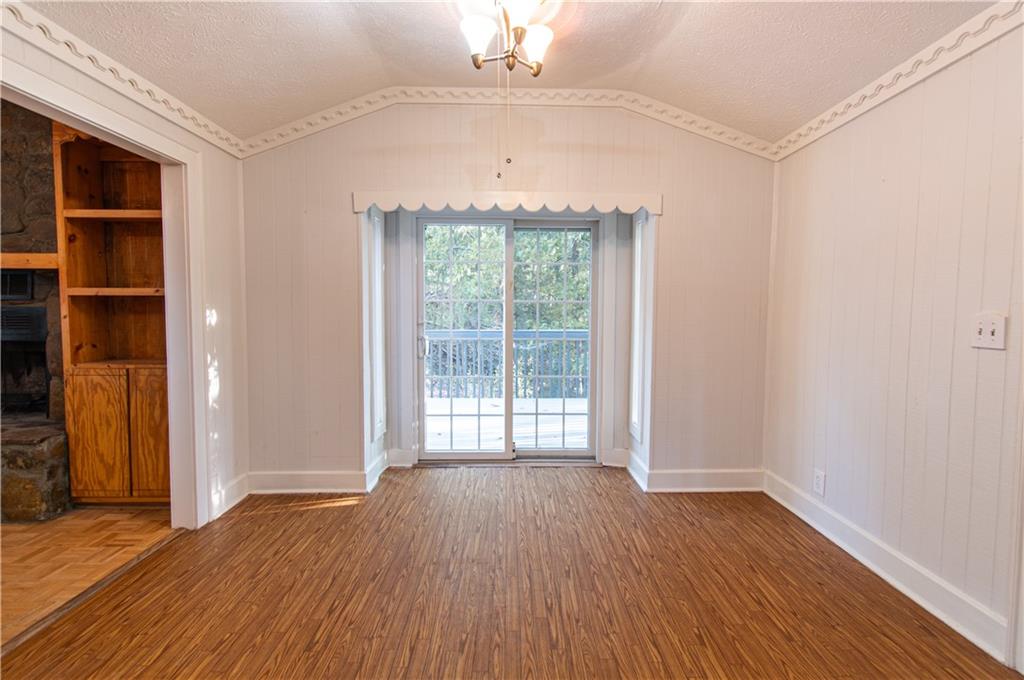 250 Nottingham Way Fairmount, GA 30139 - Photo 20 of 43 an empty room with wooden floor cabinet and windows