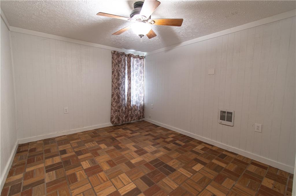 250 Nottingham Way Fairmount, GA 30139 - Photo 26 of 43 a view of an empty room with window and chandelier fan