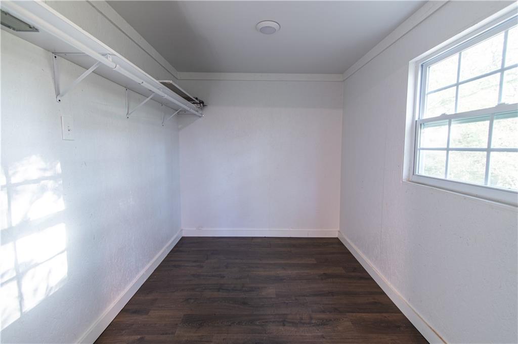 250 Nottingham Way Fairmount, GA 30139 - Photo 34 of 43 a view of a hallway with wooden floor and a window