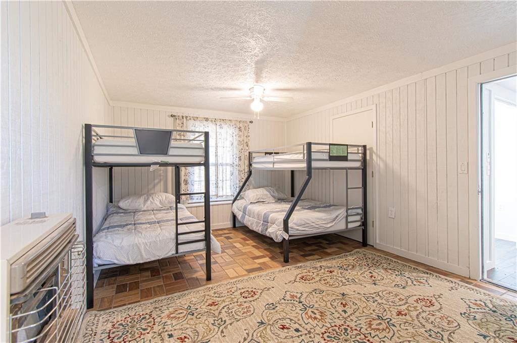 250 Nottingham Way Fairmount, GA 30139 - Photo 36 of 43 a bedroom with furniture and a window