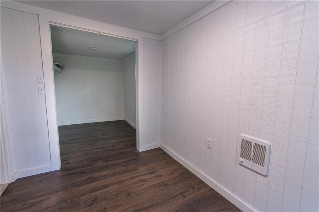 250 Nottingham Way Fairmount, GA 30139 - Photo 40 of 43 a view of an empty room with wooden floor and a window