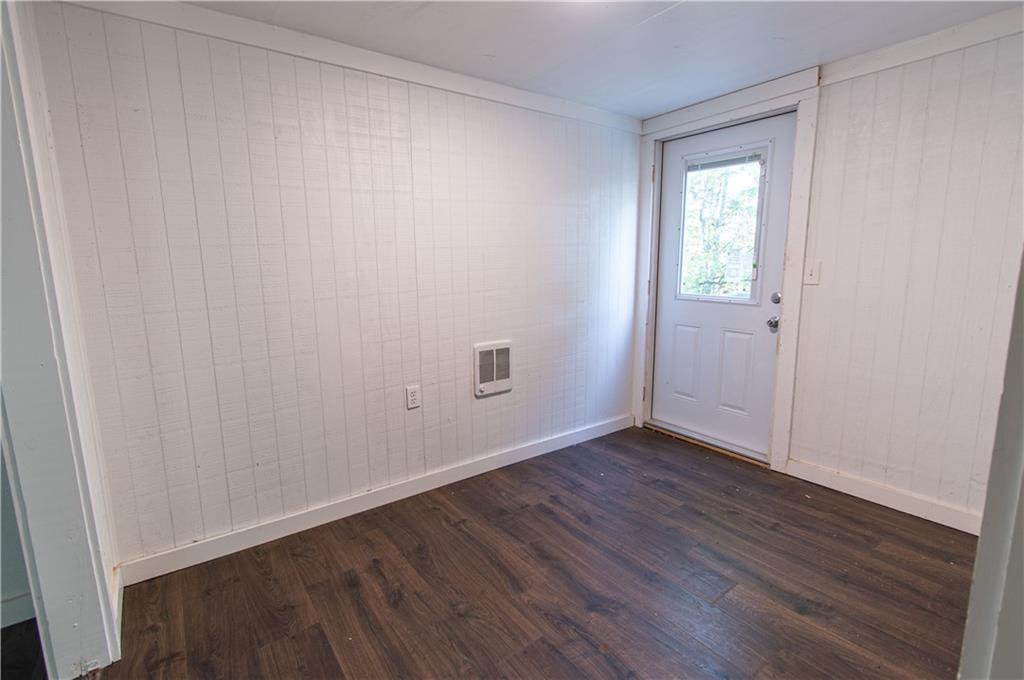 250 Nottingham Way Fairmount, GA 30139 - Photo 41 of 43 a view of an empty room with wooden floor and a window