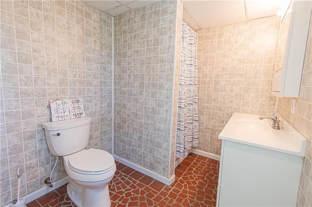 250 Nottingham Way Fairmount, GA 30139 - Photo 43 of 43 a bathroom with a sink a toilet and shower