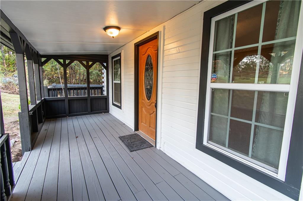 250 Nottingham Way Fairmount, GA 30139 - Photo 6 of 43 a view of balcony with wooden floor