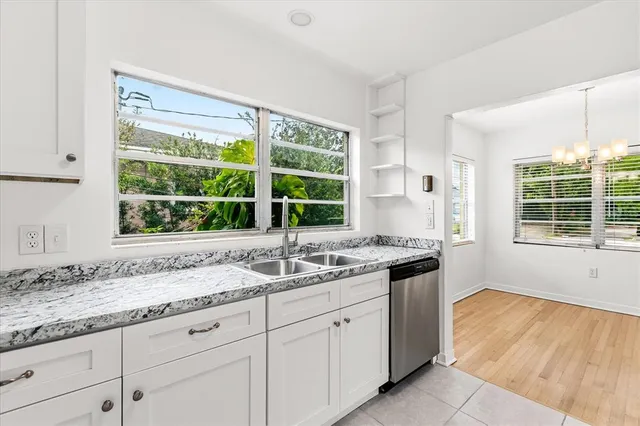 a kitchen with a sink and a window