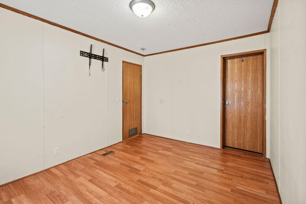 18097 Country Cross Road Florala, AL 36442 - Photo 13 of 32 a view of a room with wooden floor
