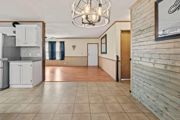 a view of a kitchen with a sink and cabinets