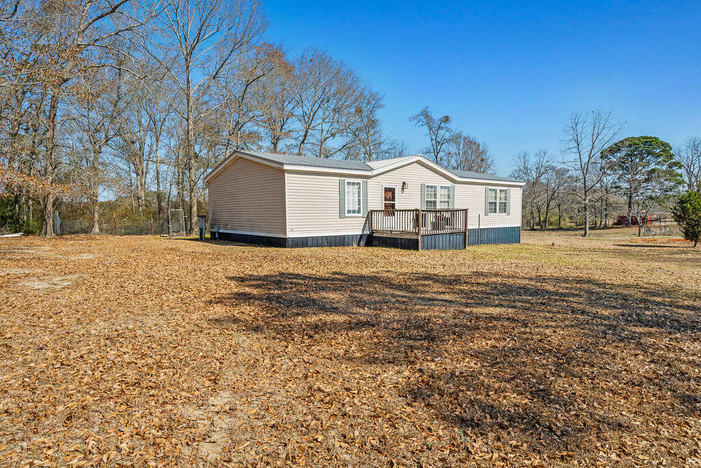 18097 Country Cross Road Florala, AL 36442 - Photo 17 of 32 a view of a house with a yard covered with snow