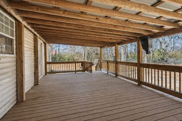 a view of a porch with wooden floor