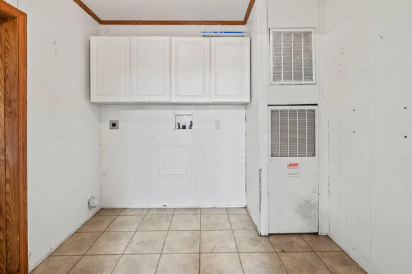 a view of kitchen with white cabinets