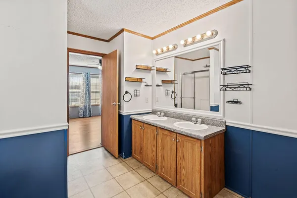a kitchen that has a sink and a stove in it