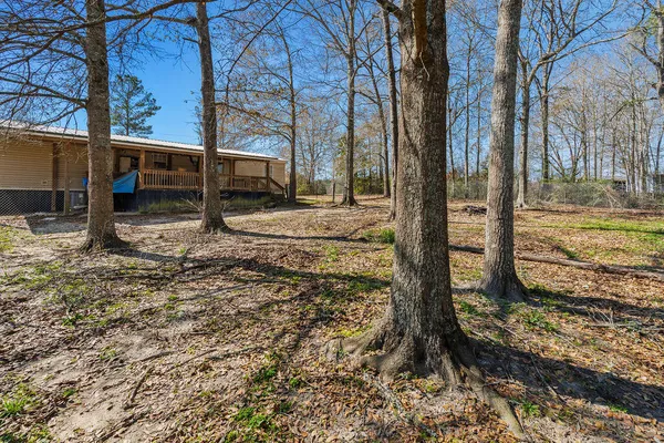 a view of a backyard of the house