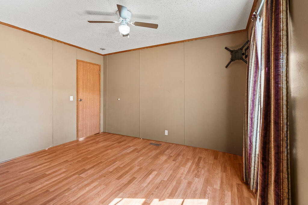 18097 Country Cross Road Florala, AL 36442 - Photo 9 of 32 a view of empty room with wooden floor