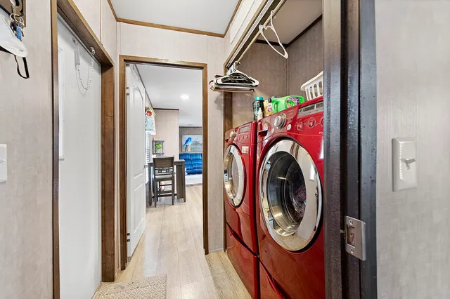 a view of a hallway with washer and dryer