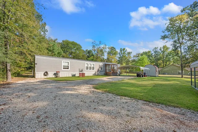 a view of a big yard with a house