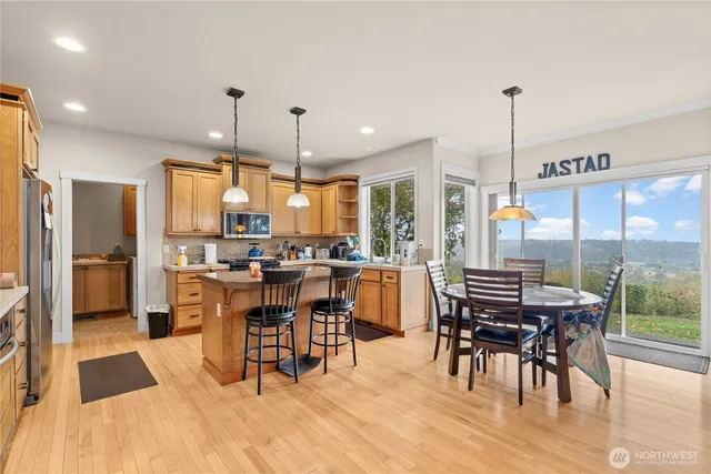 a view of a dining room with furniture window and wooden floor