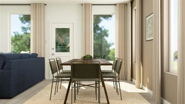 a dining room with furniture and wooden floor