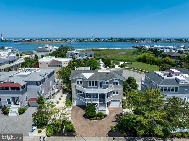 an aerial view of houses with a lake