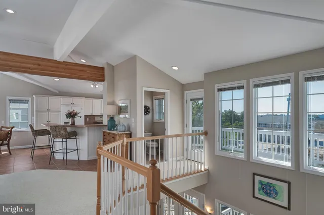 a view of a livingroom with furniture window and wooden floor