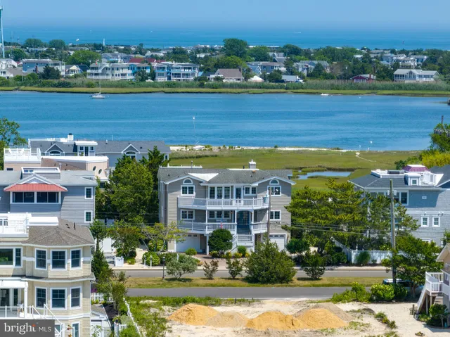 a view of a city with tall buildings and a big yard