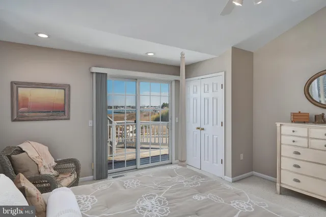 a view of a bedroom with furniture and windows