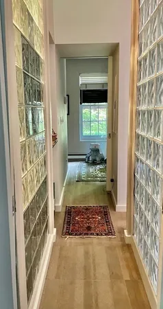 a large bed sitting in a bedroom next to a window
