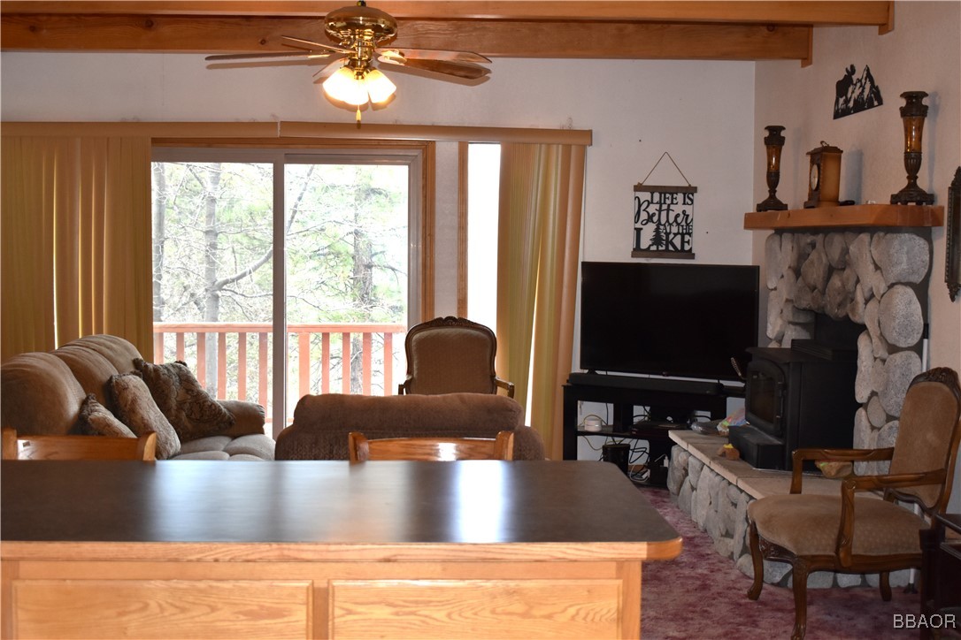 442 Inyo Avenue Sugarloaf, CA 92386 - Photo 13 of 36 a living room with furniture and a flat screen tv