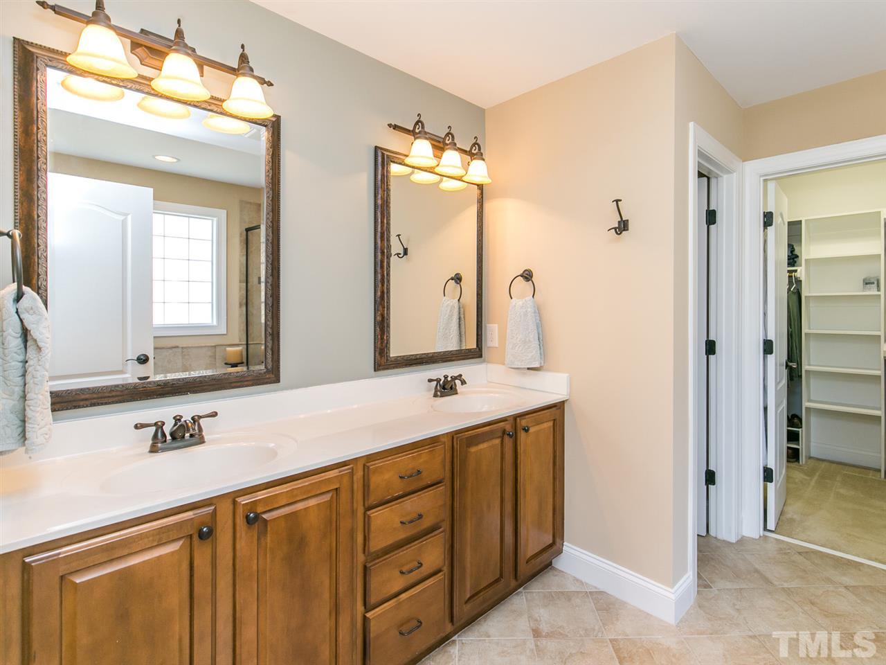 1348 Ileagnes Road Raleigh, NC 27603 - Photo 12 of 25 a bathroom with a double vanity sink mirror and double
