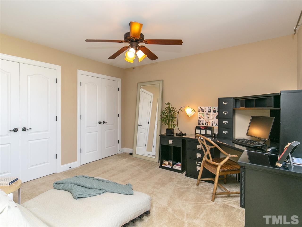 1348 Ileagnes Road Raleigh, NC 27603 - Photo 16 of 25 a room with furniture and a flat screen tv