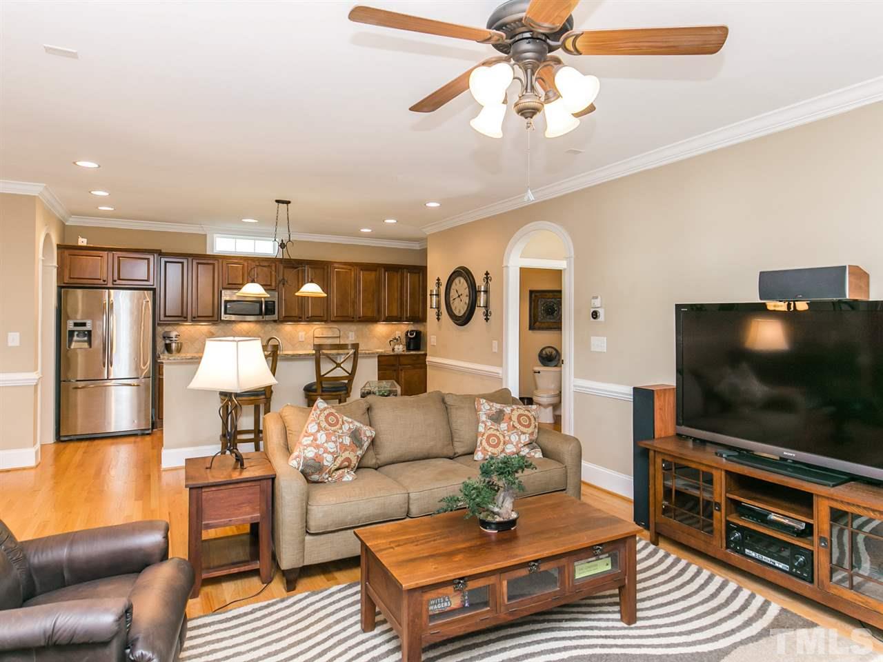 1348 Ileagnes Road Raleigh, NC 27603 - Photo 3 of 25 a living room with furniture and a flat screen tv
