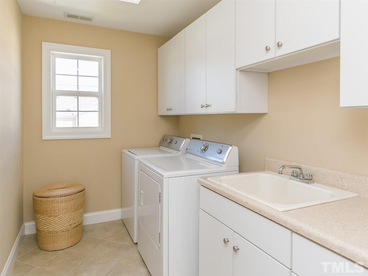 1348 Ileagnes Road Raleigh, NC 27603 - Photo 21 of 25 a utility room with dryer and washer