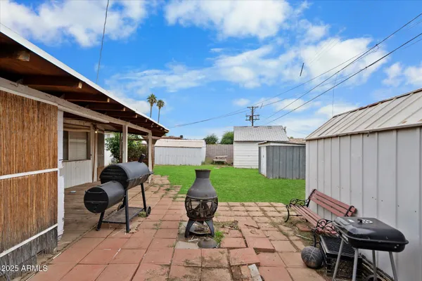a building outdoor space with patio furniture and potted plants