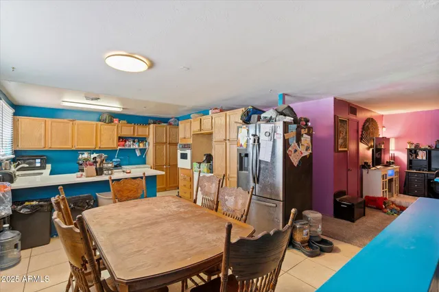 a view of a a dining room with furniture window and wooden floor