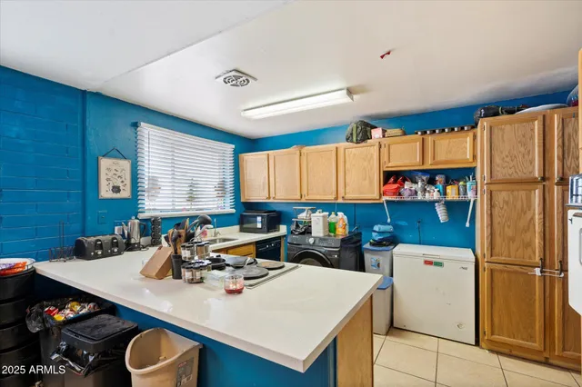 a kitchen with a sink a stove and refrigerator