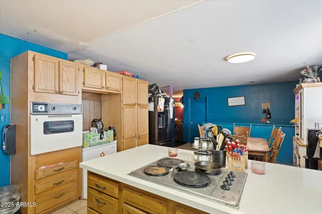 a kitchen with stainless steel appliances a sink and cabinets