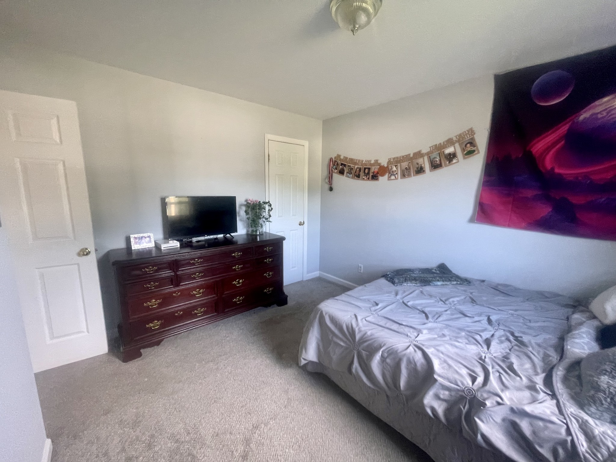 103 McClain Circle Mount Pleasant, TN 38474 - Photo 8 of 14 a bedroom with a bed and a flat screen tv