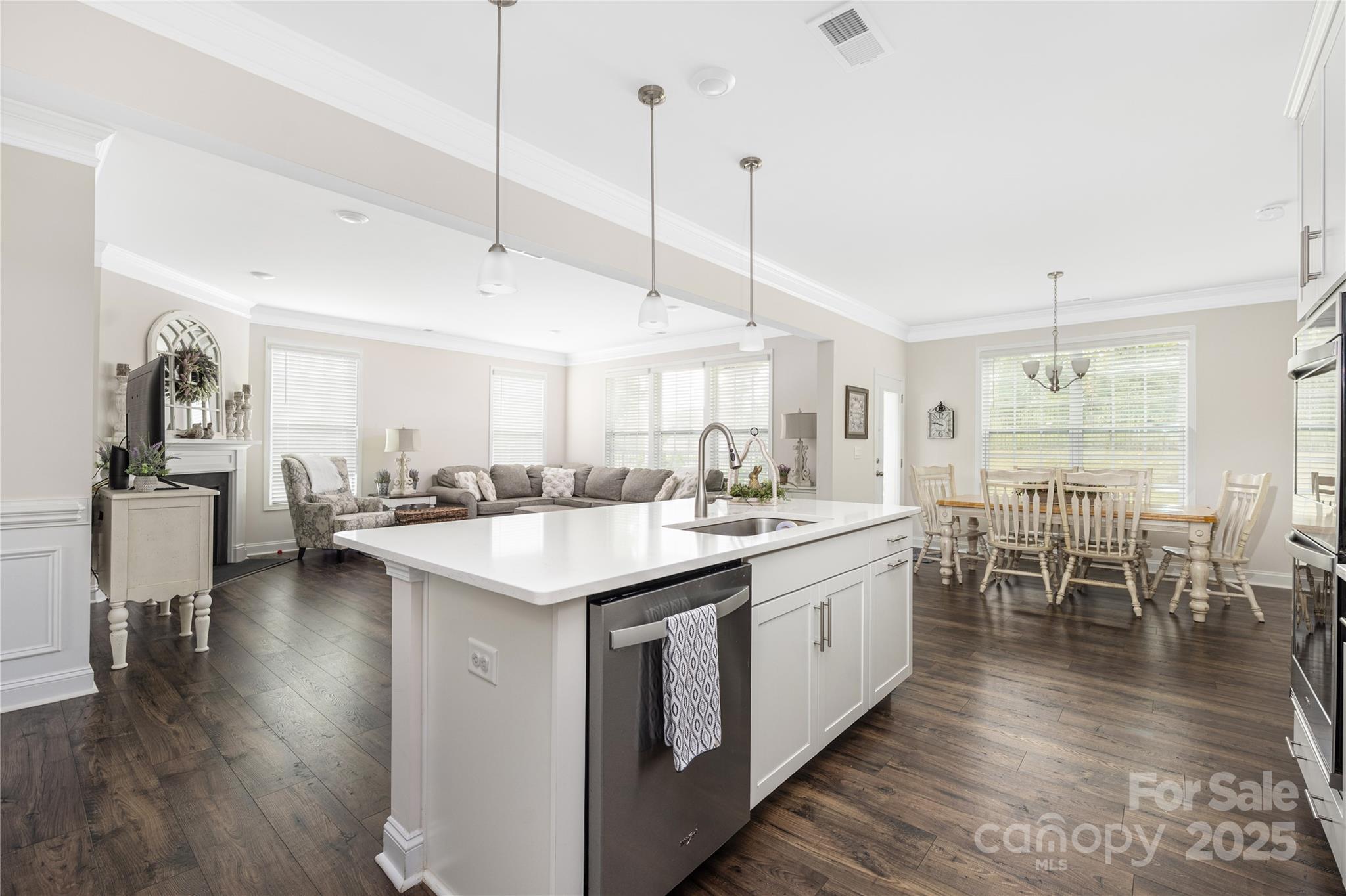 121 Rhuidean Court Troutman, NC 28166 - Photo 13 of 44 a kitchen with lots of counter space a sink appliances and dining table