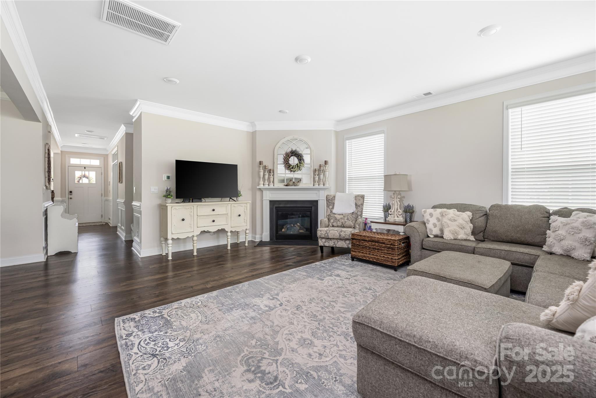 121 Rhuidean Court Troutman, NC 28166 - Photo 17 of 44 a living room with furniture and a flat screen tv