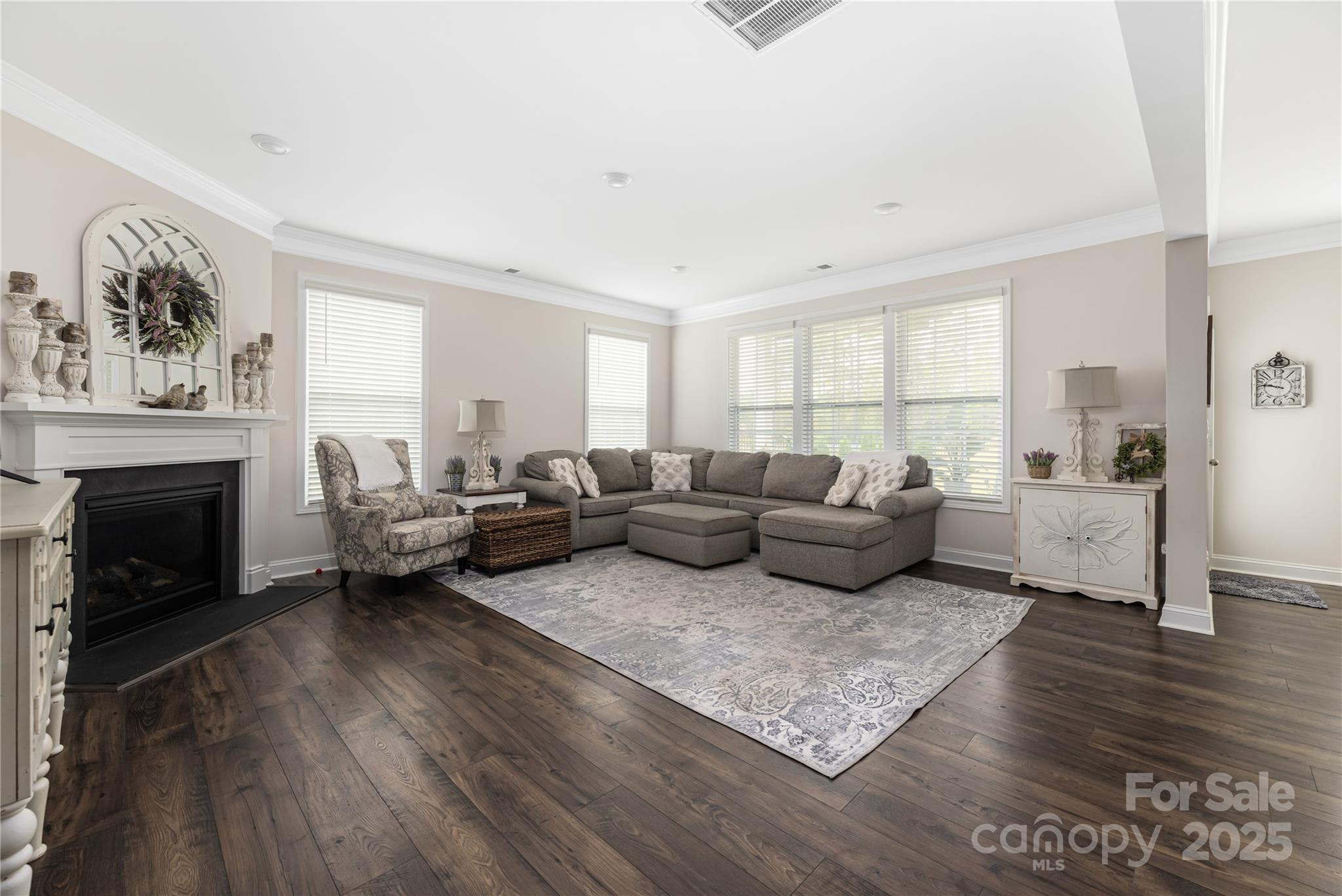 121 Rhuidean Court Troutman, NC 28166 - Photo 18 of 44 a living room with furniture and a fireplace