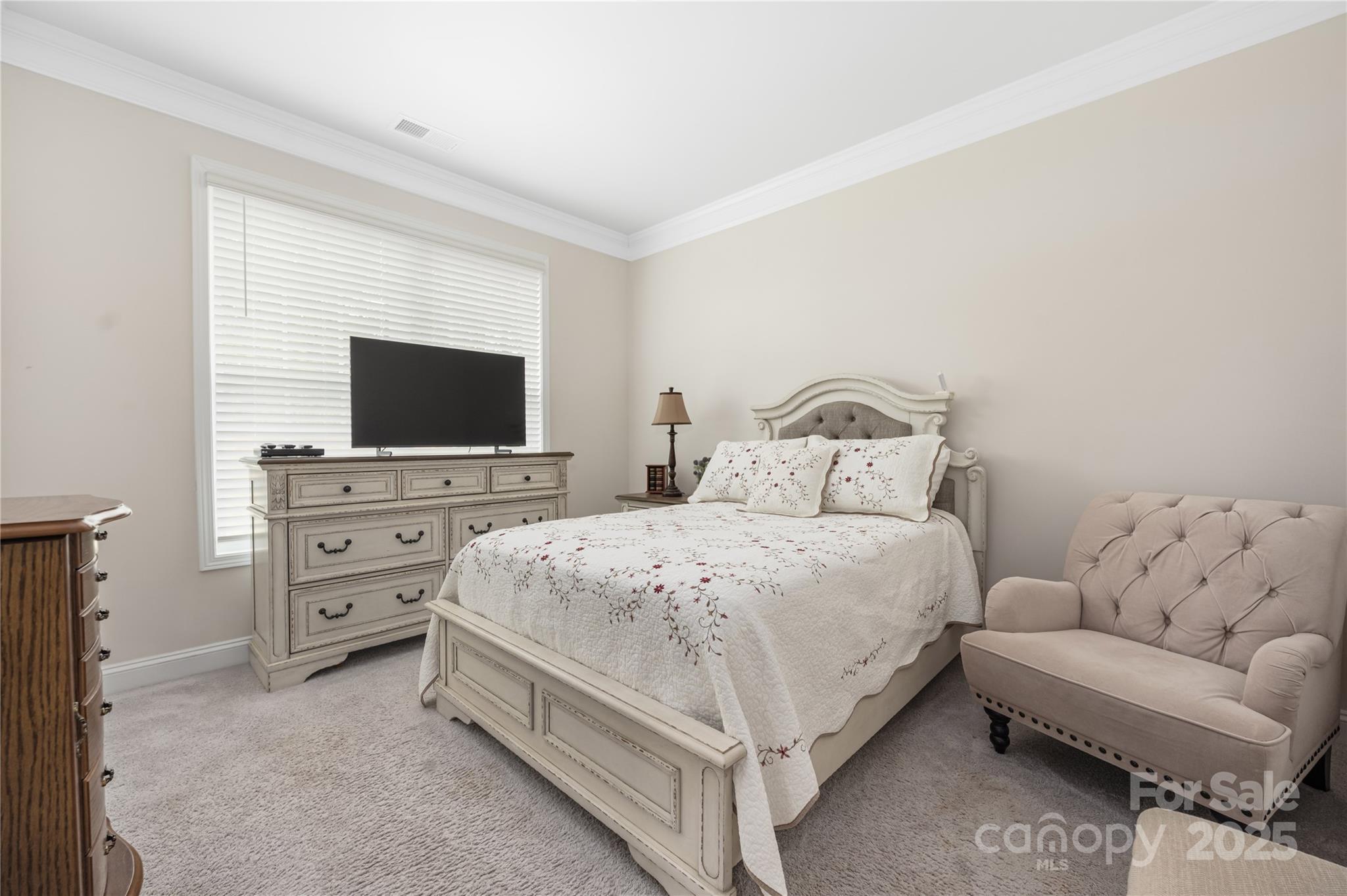 121 Rhuidean Court Troutman, NC 28166 - Photo 22 of 44 a bedroom with a bed and a flat screen tv