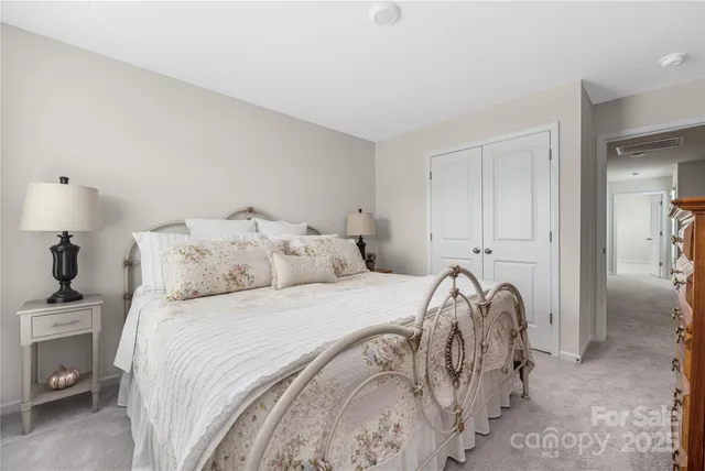 a bedroom with a bed and a view of bedroom