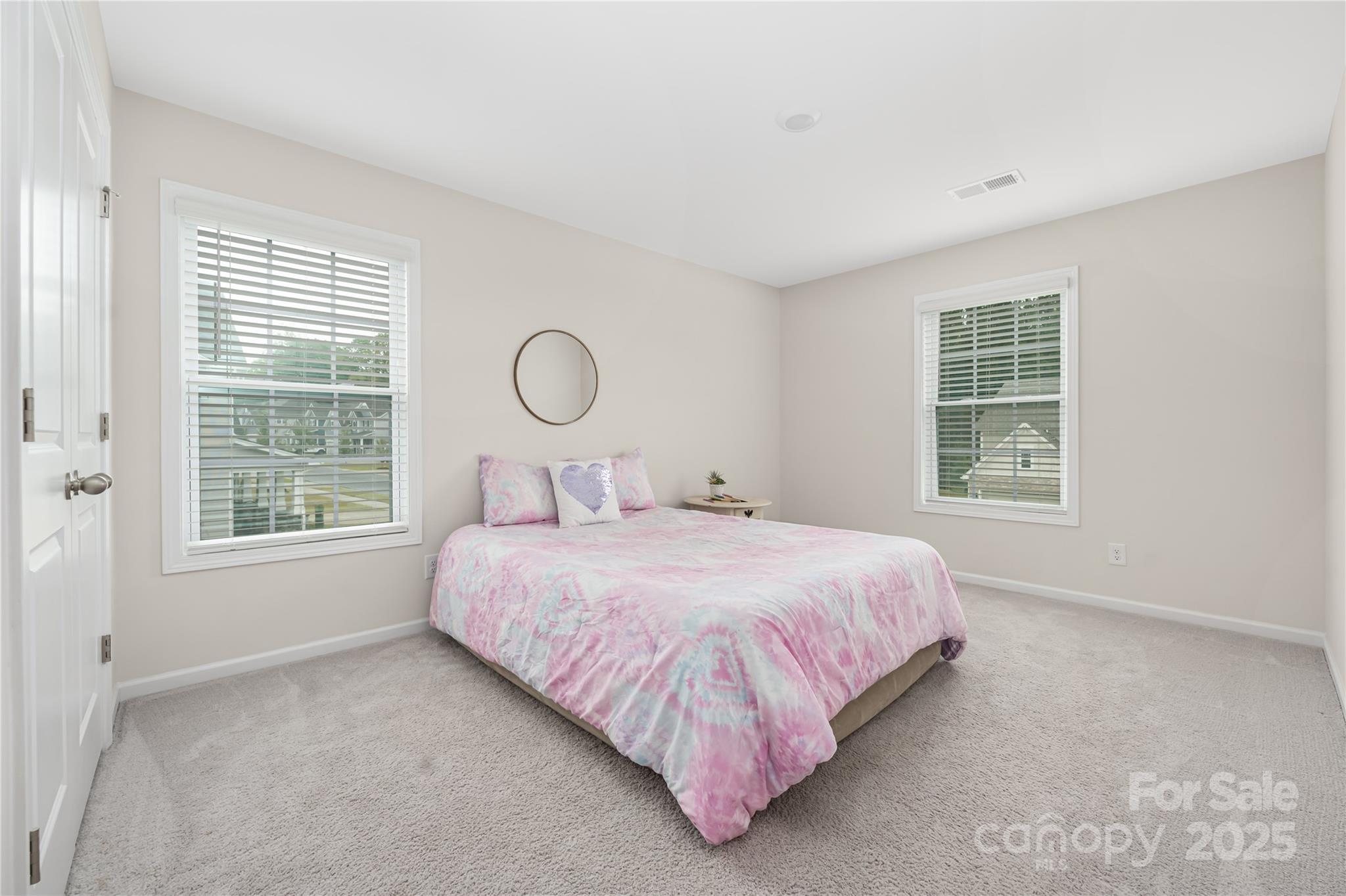 121 Rhuidean Court Troutman, NC 28166 - Photo 32 of 44 a bedroom with a bed and window