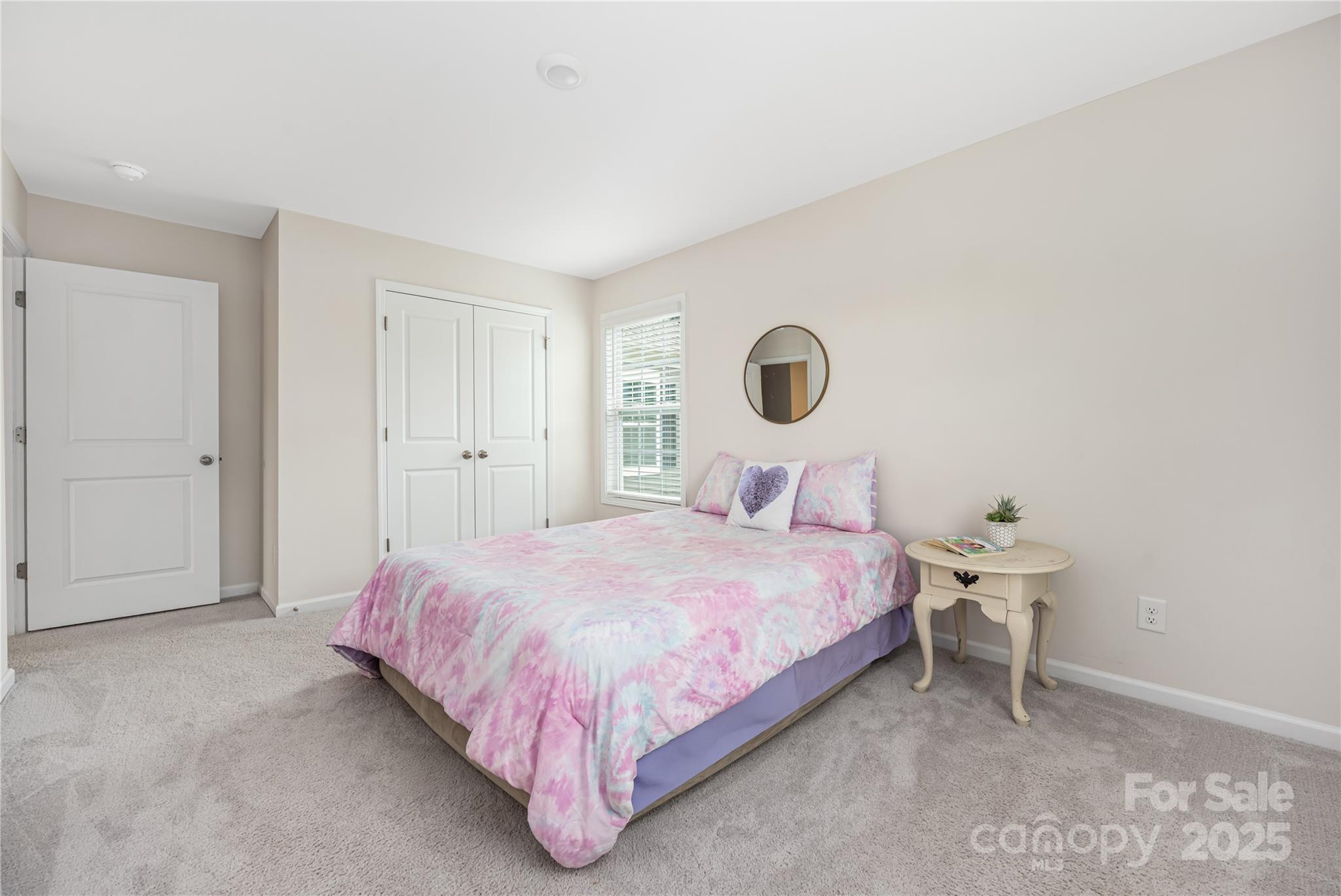 121 Rhuidean Court Troutman, NC 28166 - Photo 33 of 44 a bedroom with a bed and a lamp