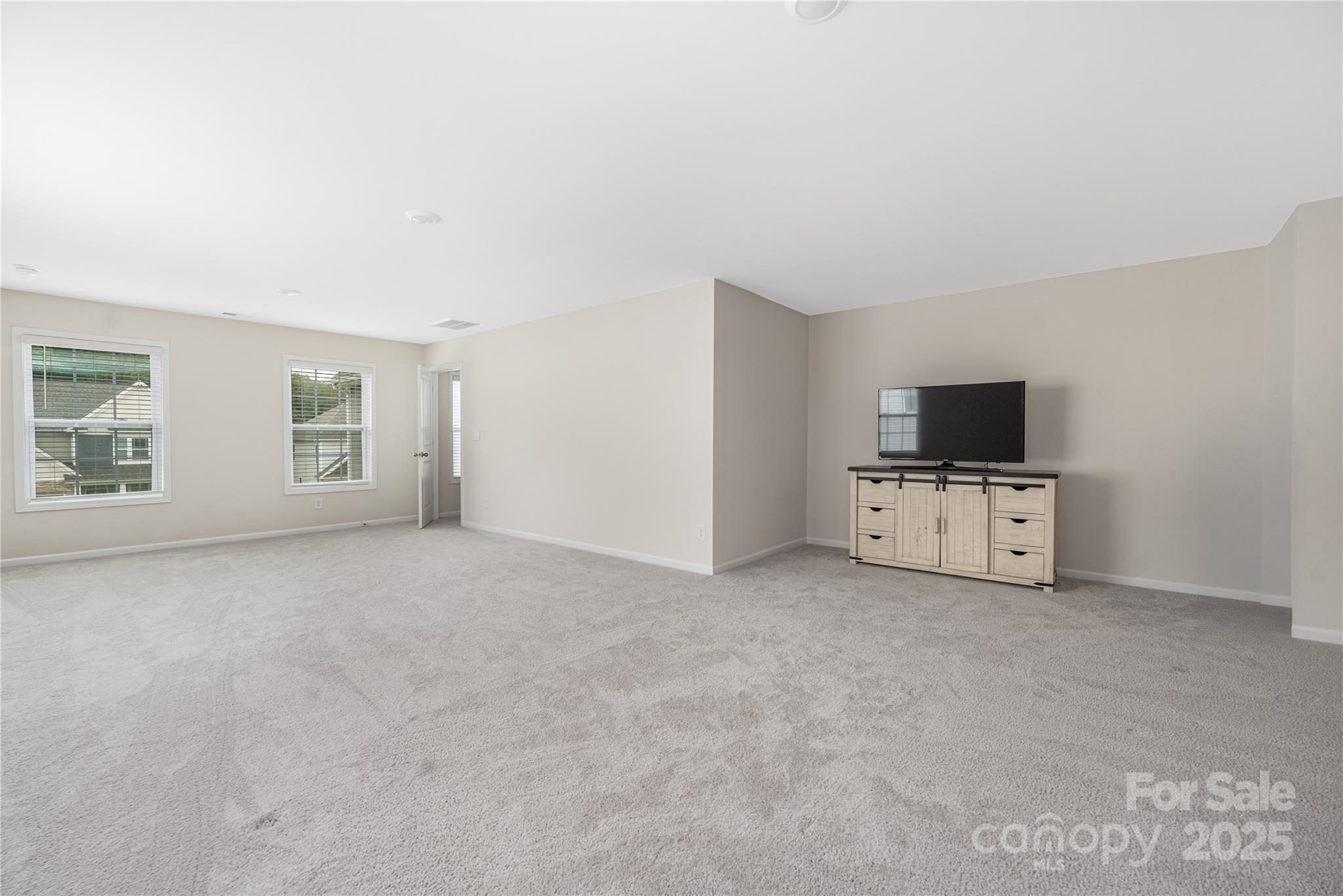 121 Rhuidean Court Troutman, NC 28166 - Photo 39 of 44 an empty room with windows