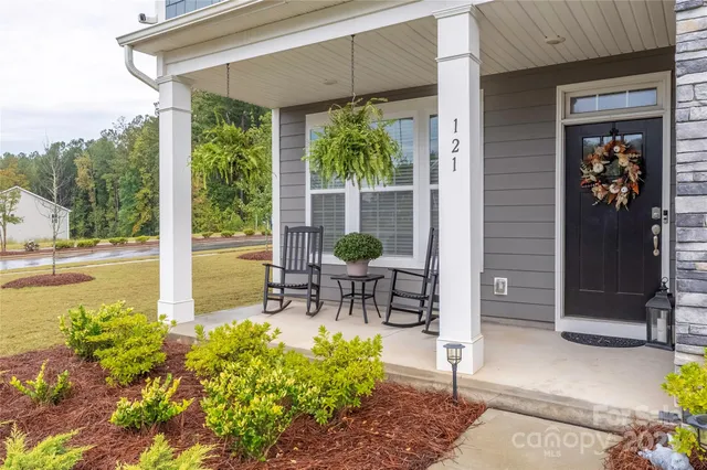 a living room filled with furniture and a garden