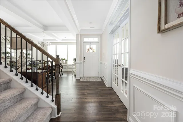 a view of an entryway with wooden floor