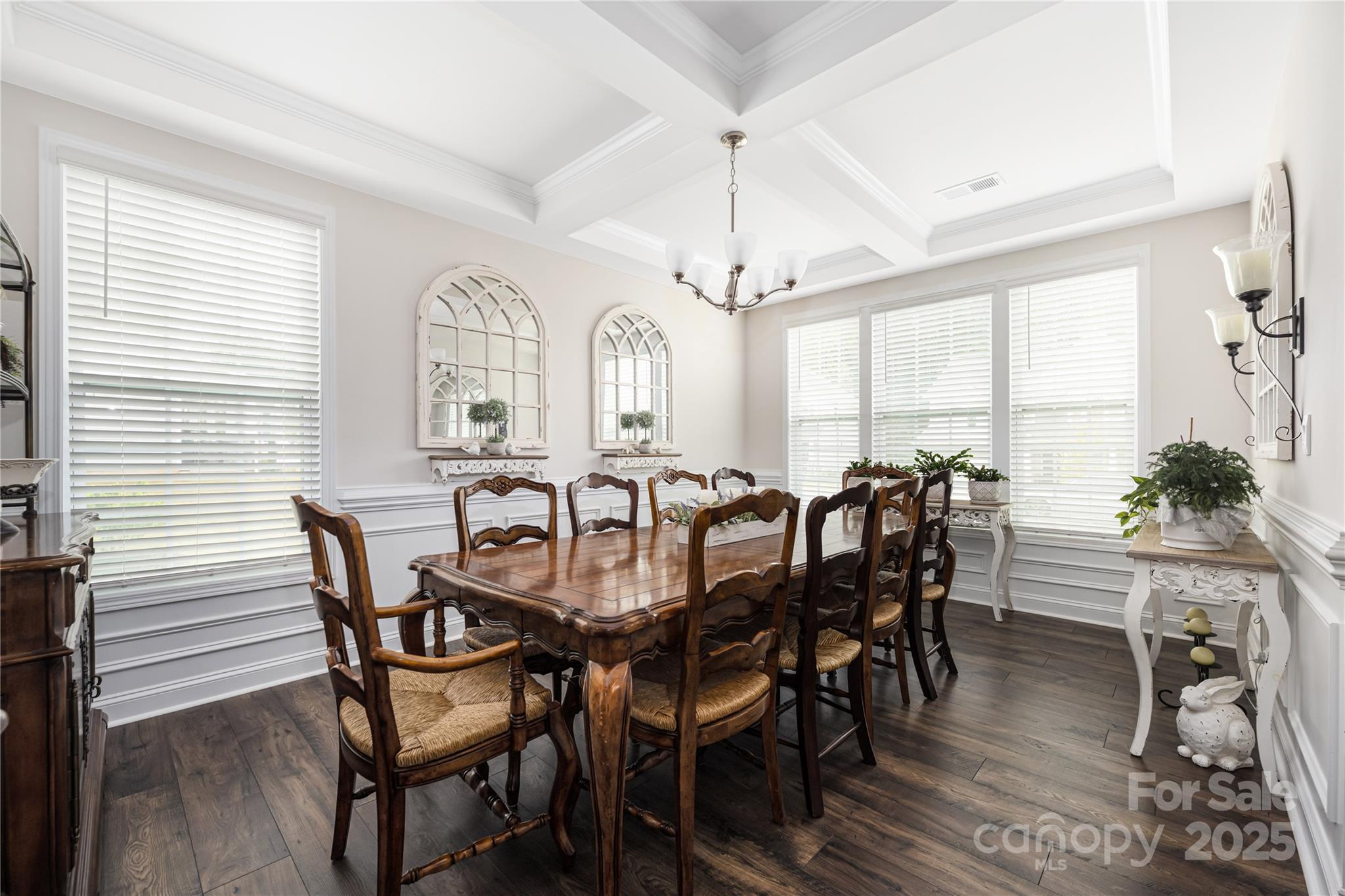 121 Rhuidean Court Troutman, NC 28166 - Photo 8 of 44 a view of a dining room with furniture window and wooden floor