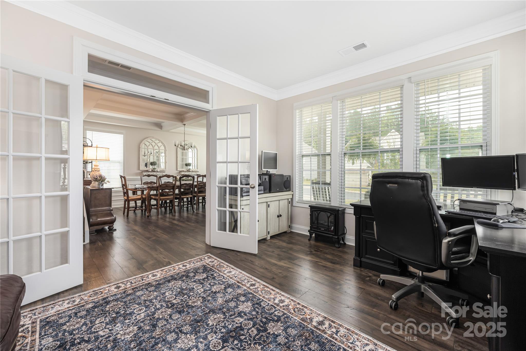 121 Rhuidean Court Troutman, NC 28166 - Photo 10 of 44 a view of a livingroom with workspace and a window
