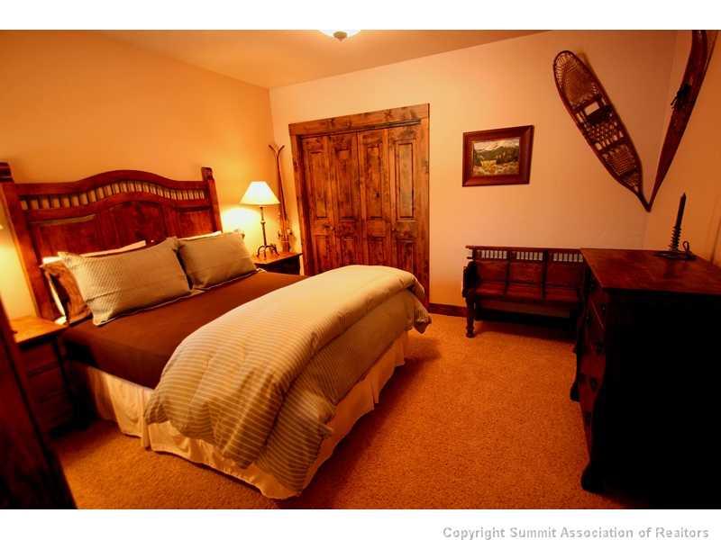 75 Uncle Sam Lode Road Breckenridge, CO 80424 - Photo 6 of 16 a bedroom with bed and a couch