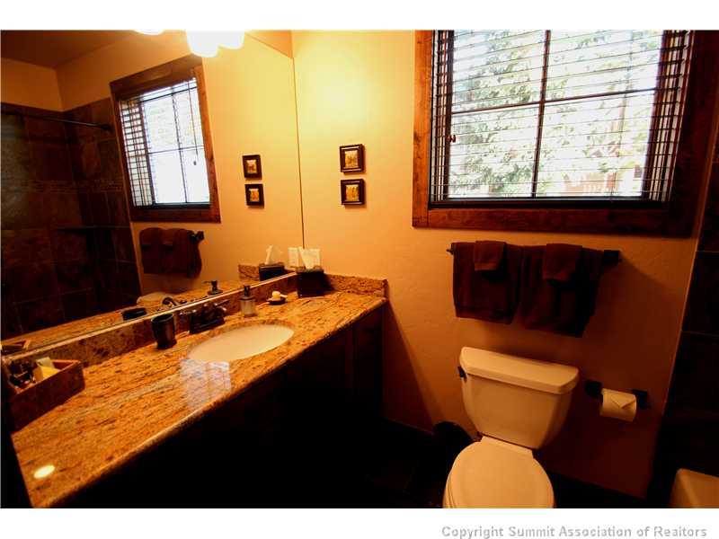 75 Uncle Sam Lode Road Breckenridge, CO 80424 - Photo 7 of 16 a bathroom with a toilet sink and mirror